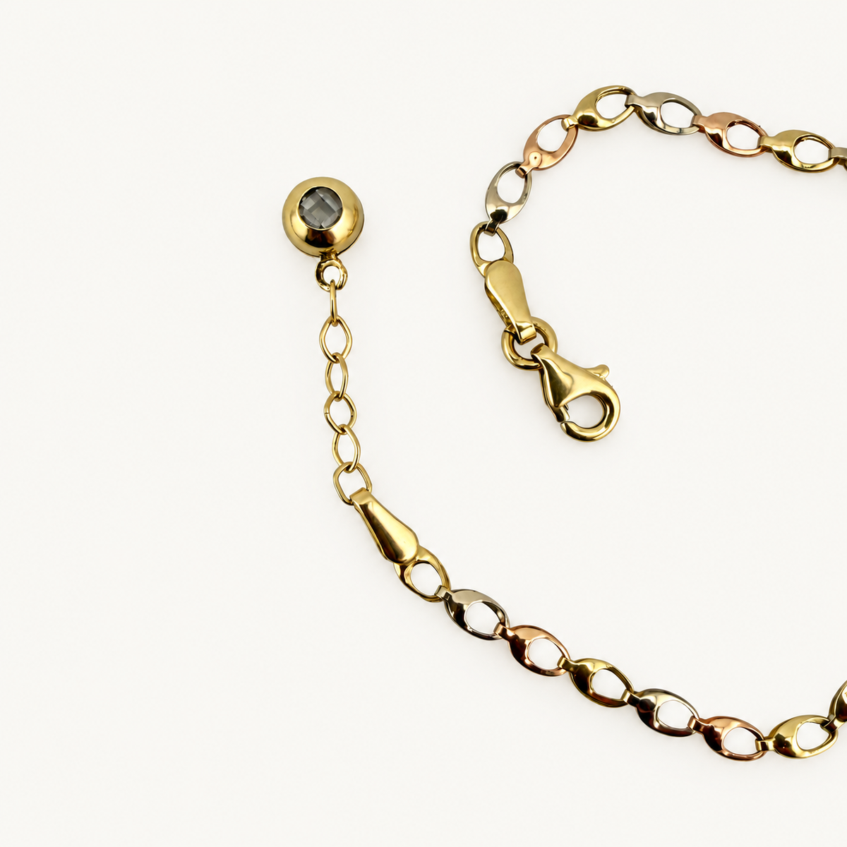 Three-motif link bracelet, clasp and extender detail